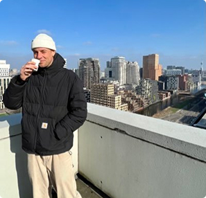 Founder on rooftop with city skyline
